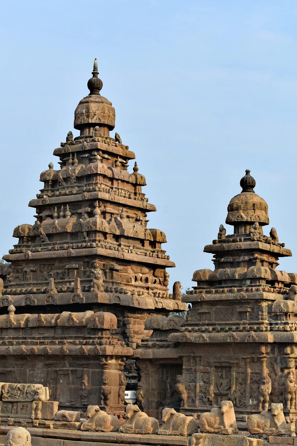 Ancient stone temple towers against a clear sky