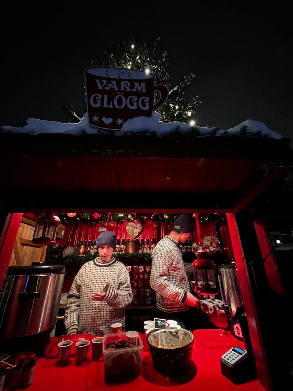 A glowing glogg stall at a winter market