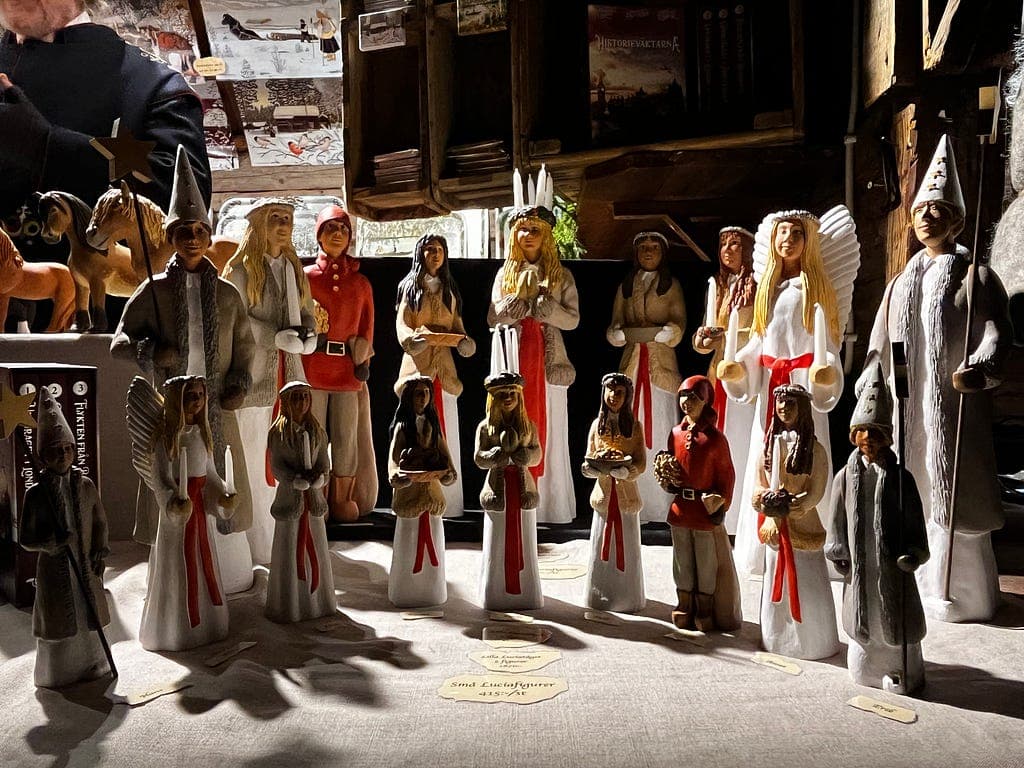 A collection of colourful handcrafted festive figures